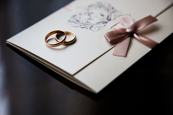 Wedding rings on the invitation card